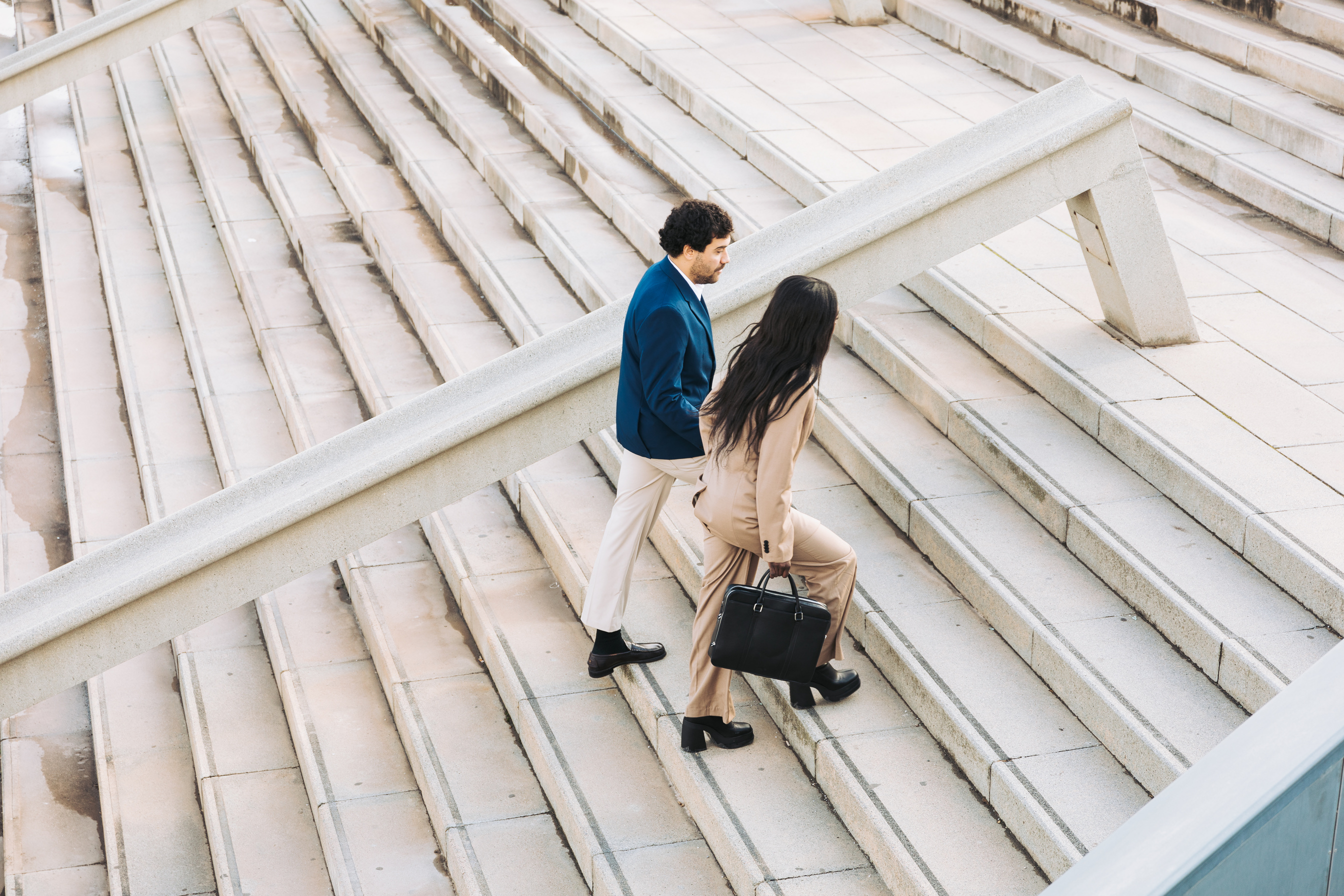 Man and Woman Walking Outdoors